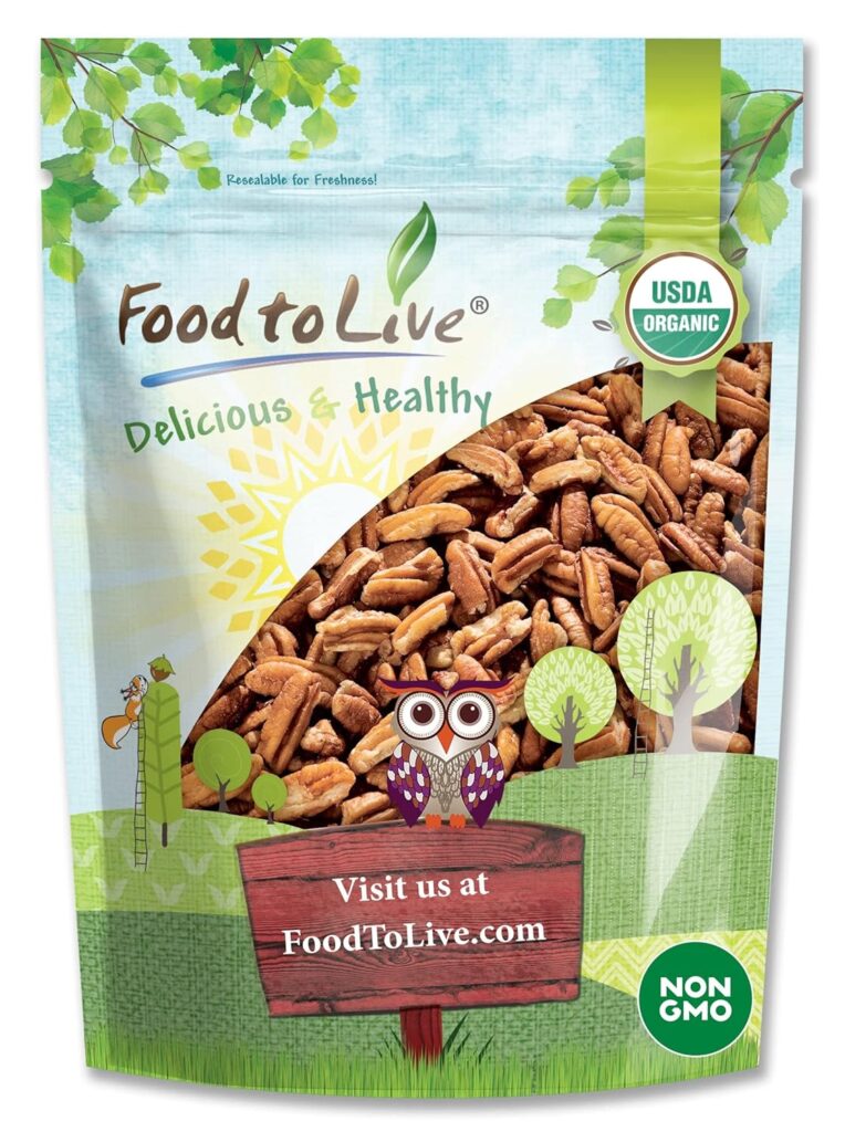 This image is of a bag of Pecans. The Brand is Food to Live, organic, non GMO. THere is a window into the bag showing the pecans. A green banner across the bottom of the bag, a wooden sign with an owl sitting on it. 