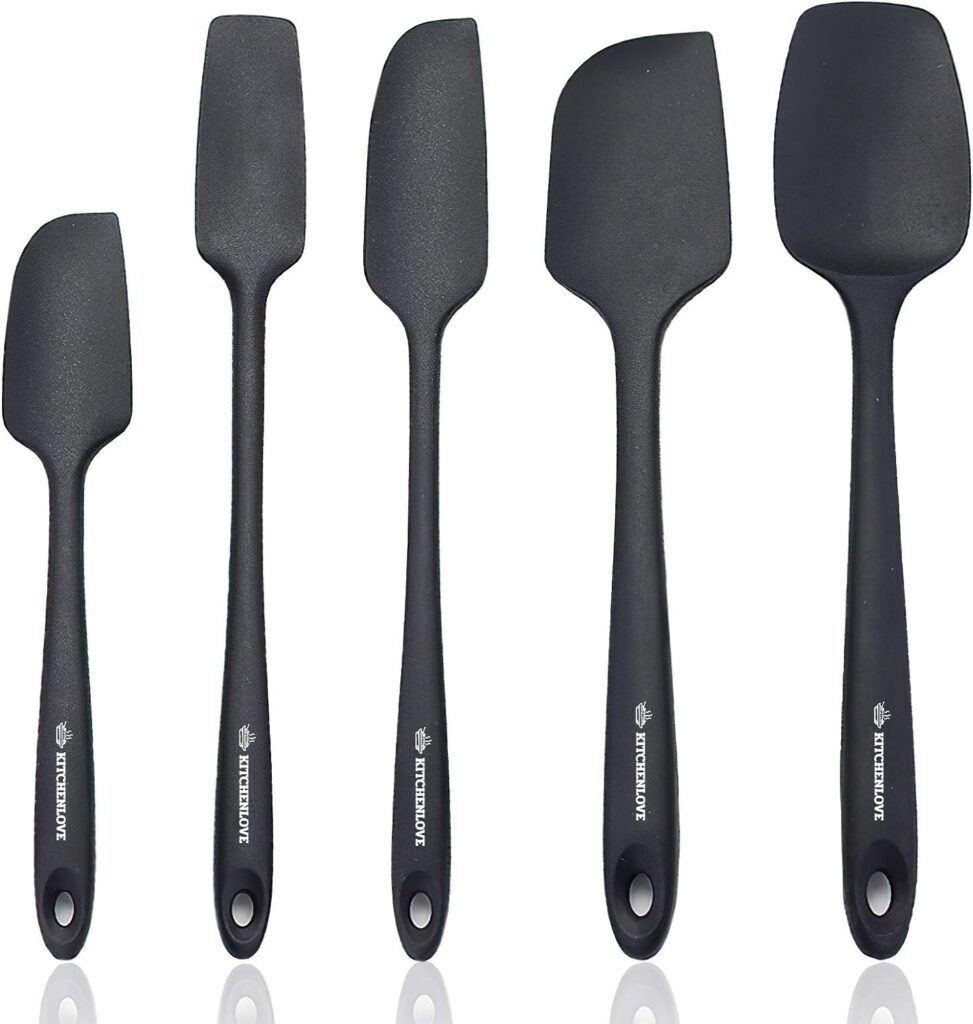 This image is of 5 black, silicone spatulas. They are different sizes and shapes.