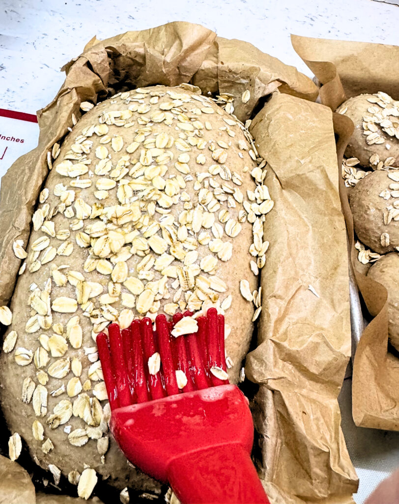 Honey oat wheat bread topped with oats