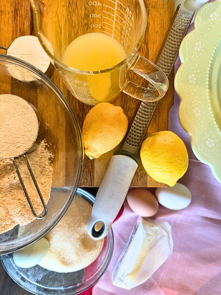 Lemon bar ingredients on a table with a pink runner
