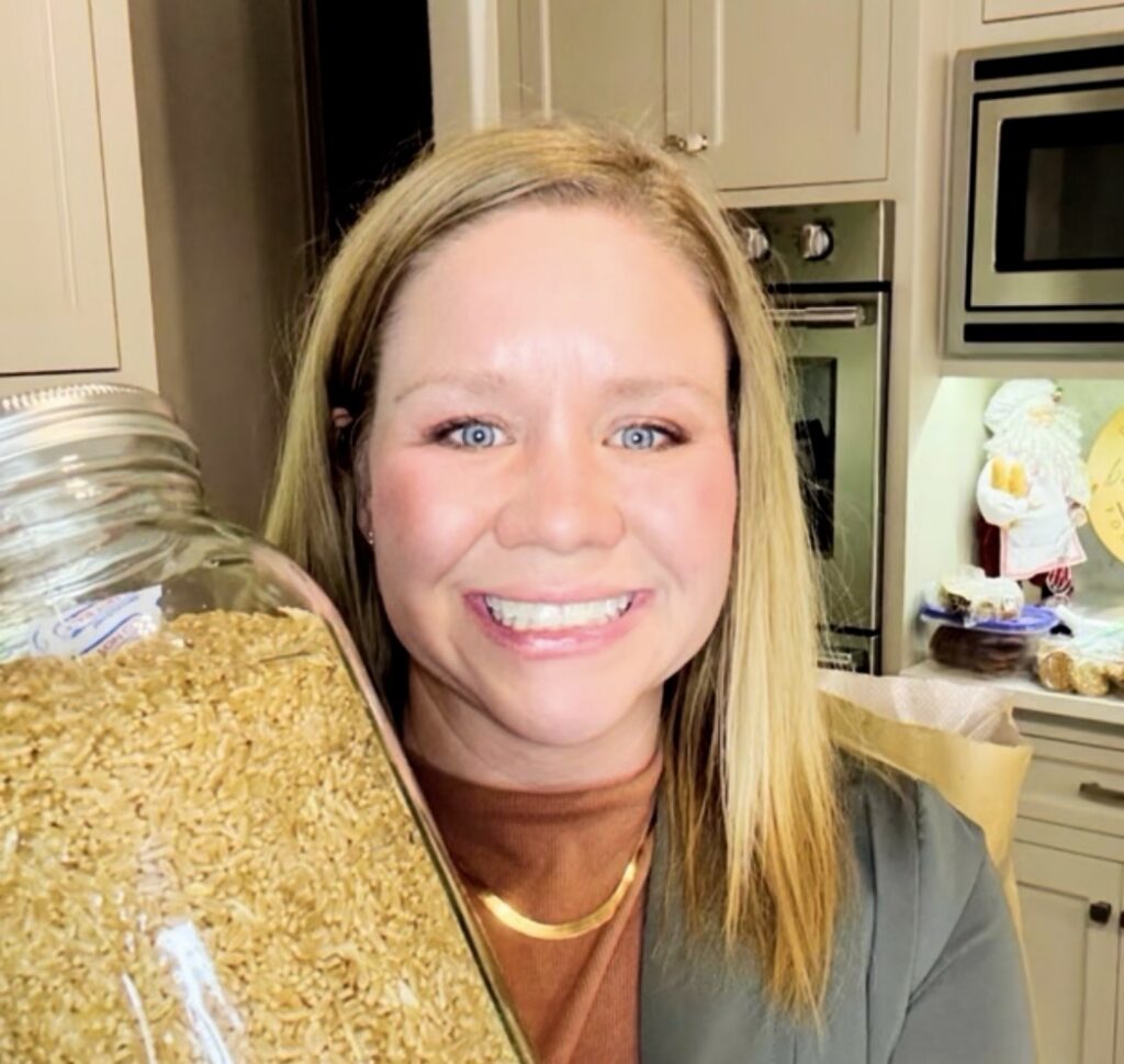 Krista Bailey holding grains to teach baking classes in Lubbock